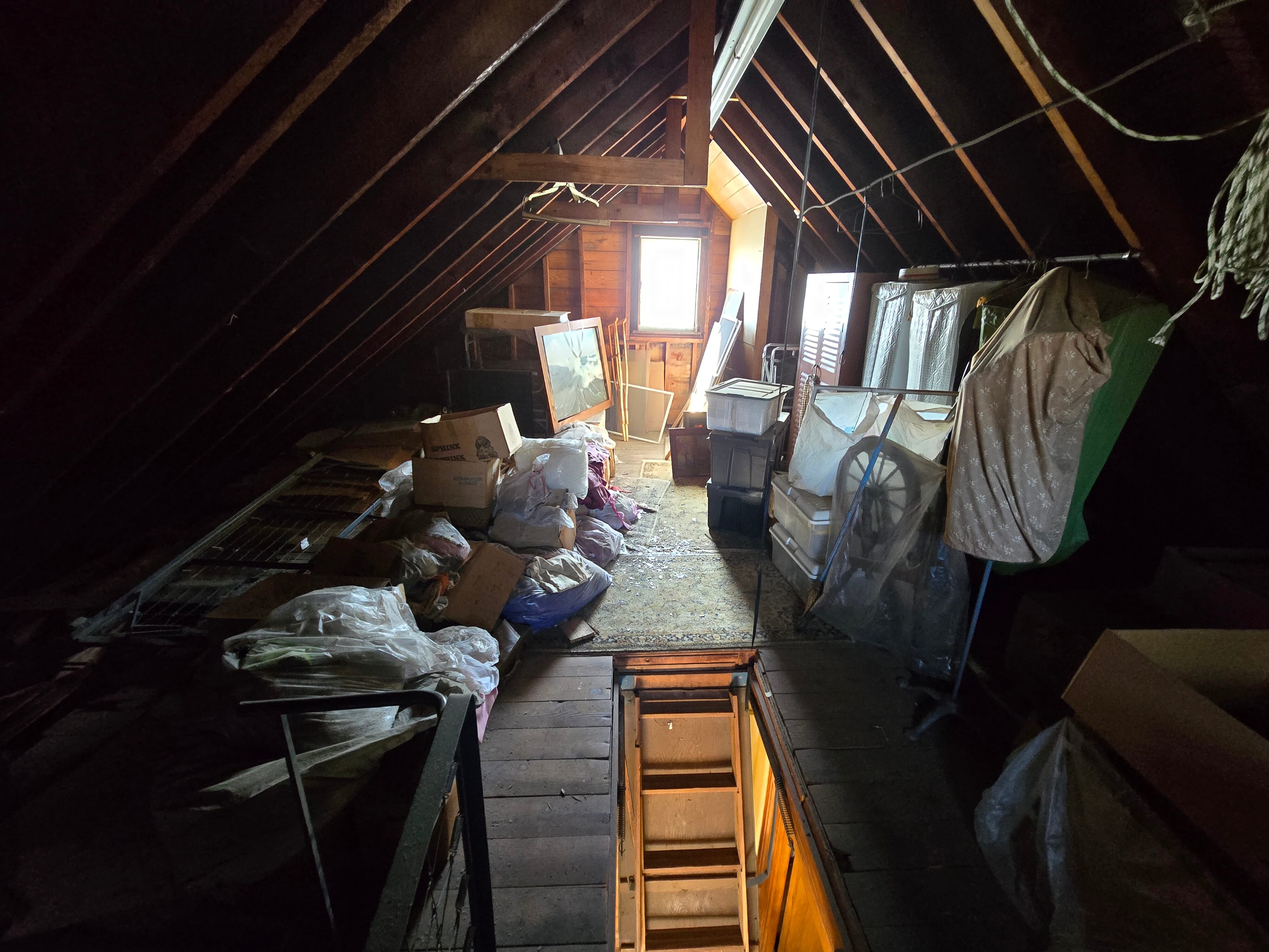Attic before junk removal in NYC